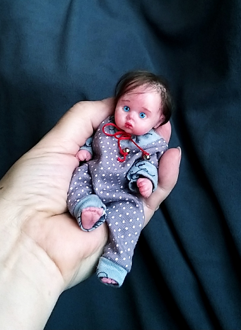 Minireborn with pacifier and bootle, original clothes